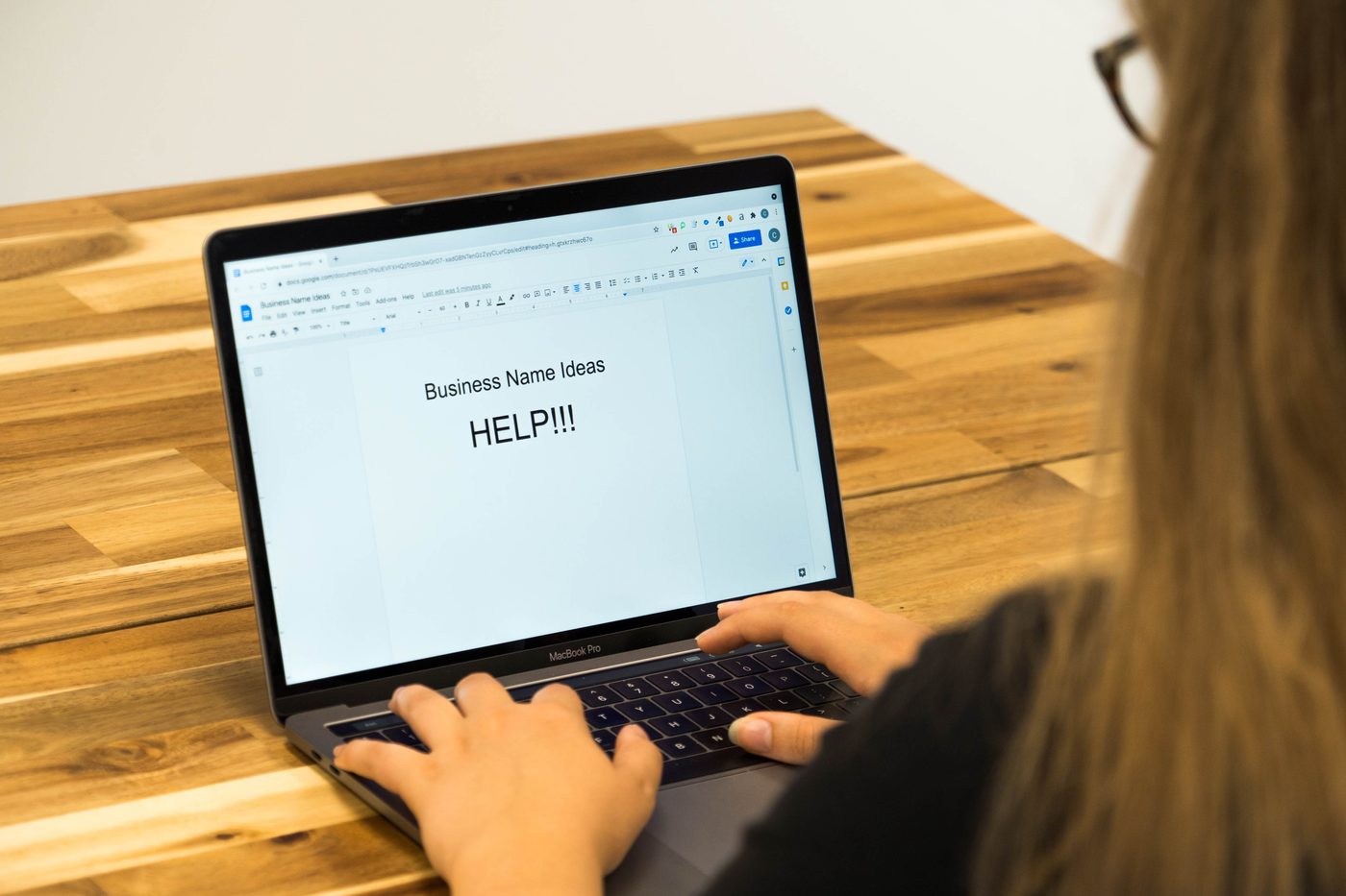 Working on brand naming at a laptop